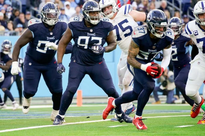Tennessee Titans safety Amani Hooker (37) intercepts an Indianapolis Colts two-point conversion attempt during the third quarter at Nissan Stadium in Nashville, Tenn., Sunday, Dec. 3, 2023.  